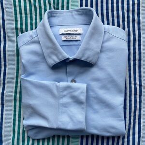 Calvin Klein X extra slim fit wicking/stretch button front shirt light blue Sz S
